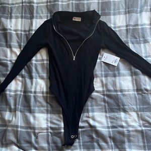 Black half zip up body suit
